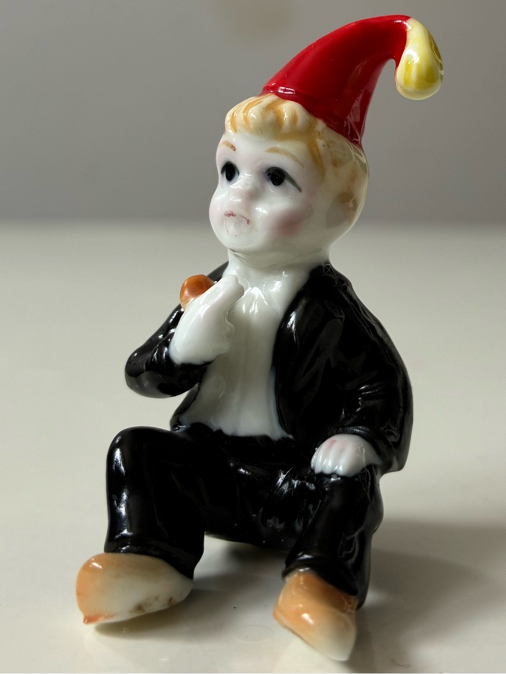 Vintage Miniature Ceramic Boy wearing red birthday party hat mini figure